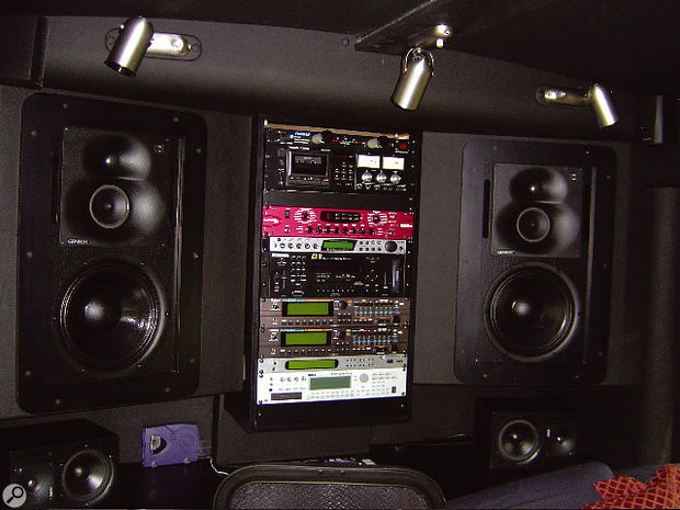 The main monitors and gear rack on the back wall of the bus. The main monitors and gear rack on the back wall of the bus.