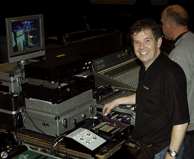 The author on the Bill Nelson tour with his live video mixing rig. The LCD monitor at the top was for checking the four inputs to the Krossfour video mixer without affecting the main output to the on-stage screen. Below that is the DVD player used for the pre-recorded video material during the show, and at the bottom are the white control unit for the two cameras used on stage, plus the Entrancer and Krossfour (right). The Korg units both had to have home-made 'labelling' added due to the lack of built-in scribble strips. The author on the Bill Nelson tour with his live video mixing rig. The LCD monitor at the top was for checking the four inputs to the Krossfour video mixer without affecting the main output to the on-stage screen. Below that is the DVD player used for the pre-recorded video material during the show, and at the bottom are the white control unit for the two cameras used on stage, plus the Entrancer and Krossfour (right). The Korg units both had to have home-made 'labelling' added due to the lack of built-in scribble strips.