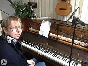 Pianist and arranger Tim Baxter at State Of The Ark's Broadwood upright piano, which features on several songs from Tribute.