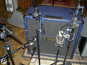 John Porter favours miking guitar cabs as close as possible. Here, his trusty SM57 (centre left) is joined by a Sennheiser MD421 (bottom left) and MD409 (centre-left), and a Neumann U67 and RCA 77 (right). John Porter favours miking guitar cabs as close as possible. Here, his trusty SM57 (centre left) is joined by a Sennheiser MD421 (bottom left) and MD409 (centre-left), and a Neumann U67 and RCA 77 (right).