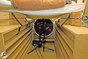 By building an impromptu ‘isolation tunnel’ over the kick–drum microphones, we were able to shield them from the worst of the upper–spectrum spill from the cymbals and electric guitars. By building an impromptu ‘isolation tunnel’ over the kick–drum microphones, we were able to shield them from the worst of the upper–spectrum spill from the cymbals and electric guitars.