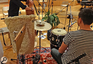 By gaffering a thick bathmat to a spare mic stand, Mike was able to use it to intercept excessive high frequencies from a bell tree before they reached the main stereo pair, thereby reducing the prominence of this instrument in the recorded ensemble balance. By gaffering a thick bathmat to a spare mic stand, Mike was able to use it to intercept excessive high frequencies from a bell tree before they reached the main stereo pair, thereby reducing the prominence of this instrument in the recorded ensemble balance.