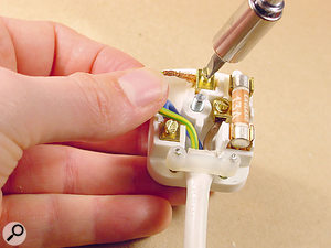 Disconnecting the earth wire inside a mains plug might solve an earth loop problem, but it's a dangerous solution, because you're removing an essential electrical safety measure.