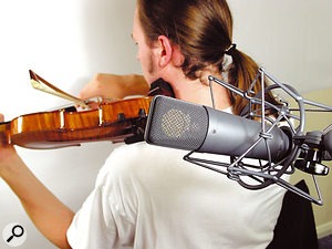 When you're short of players and you need to overdub, a good trick is to record the different takes in different positions. Keep the mic a fair distance away, so as to capture some room sound, which will help to make the tone different for different takes, thus creating the impression of different instruments and avoiding potential phase problems.