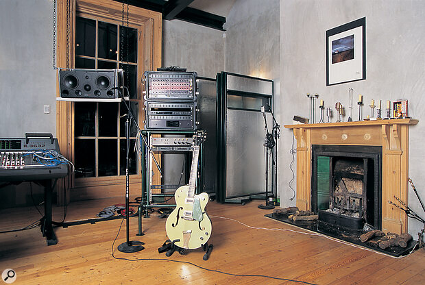 Alan's guitar and processing rack, containing his Drawmer compressors and gates,
Lexicon PCM70 reverb, Yamaha SPX90 effects, and Roland R880 reverb/delay.