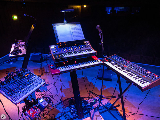 The on-stage nerve-centre of the project, effectively. Moog, Nord and Oberheim synths with Behringer mixer, Electro-Harmonix vocoder and Zoom multi-effects unit. Multiple expression pedals were used to control the synths while leaving hands free to play.