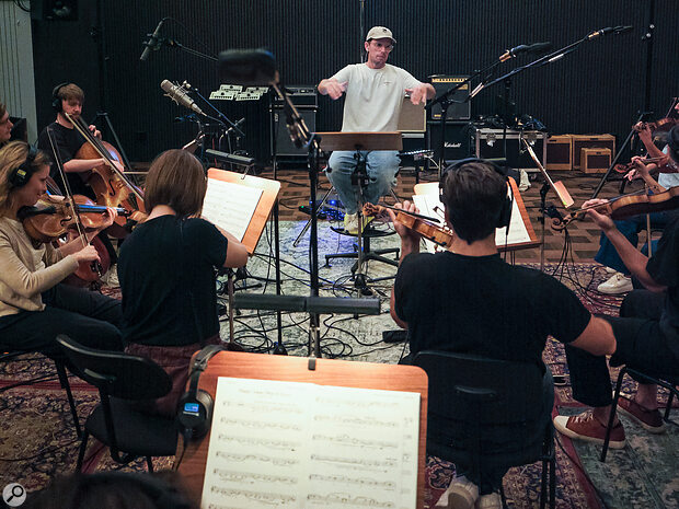 Standard SSO practice is to close mic each desk (pair) of players.