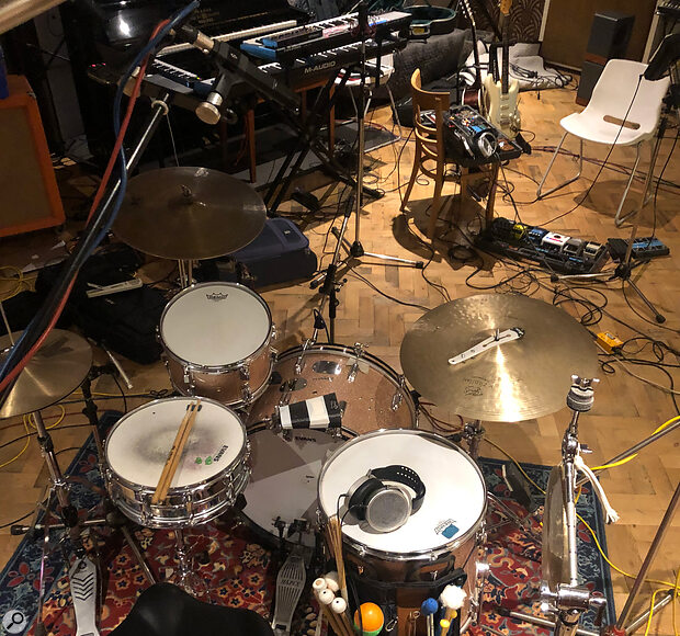 A quick snap of the rather busy live room at Half Ton Studios, taken during a break in the session described in the text. Jem Doulton’s drum kit is in the foreground, with some Hifiman open‑backed cans visible on the floor tom. Behind him you can see Ted Morcaldi’s guitars and pedalboard, and Tom Rogerson’s keyboard rig. Ted’s amps were in a different room in order to achieve better isolation.