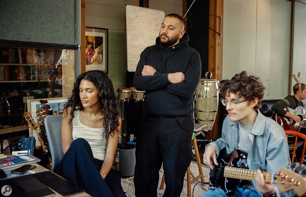 Zach Nahome (centre) with Olivia Dean and bassist Finn Zeferino‑Birchall.