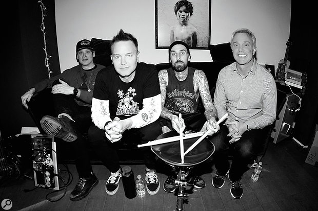 Producer and co-writer John Feldmann (right) poses with the three members of Blink 182 during the making of California. From left: Matt Skiba, Mark Hoppus, Travis Barker.