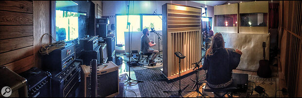 This panoramic shot shows the live room at The Meadow as set up for basic tracking on Lankum’s The Livelong Day. The four band members (including Radie Peat, nearest to camera) were separated by a cross‑shaped arrangement of baffles, with mirrors at the centre of the cross enabling them to see one another.