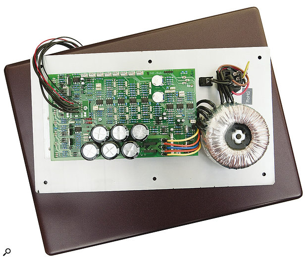 The amplifier PCB. On the right is the toroidal mains transformer, while to the left, you can see the diodes used to control the output stages' biasing and switching.