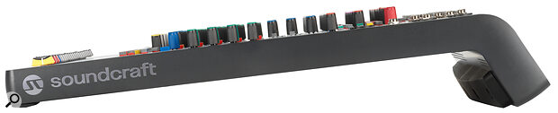 The L‑shaped profile angles the controls towards the user, while rubber padding along the back edge functions as a handle for transport.