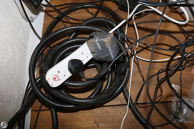 The culprit: a  large step-down transformer, which was inducing the hum in the multicore cable.