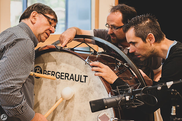 Percussive family (L-R) Leo, Tom and Tim Ouderits take a  fervent interest in a bass drum.