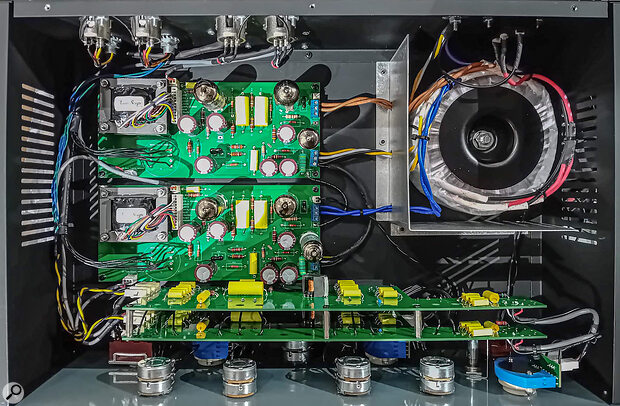 Lifting the lid, you can see two channel PCBs, with three NOS valves (a 12AX7, a 12AU7 and a 6X4 rectifier) and a custom‑wound, iron, inter‑stage transformer on each.