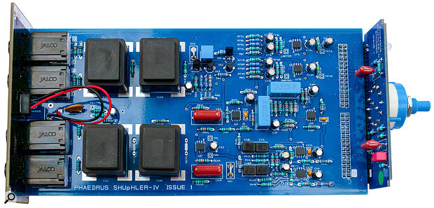 A view of the internal circuitry of the SHUpHLER showing the input and output transformers at the left next to the audio connectors, and the active shuffling circuitry to the right with the rotary selector switch on the vertical board.