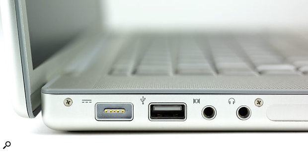 Apple's new Macbook Pro features the 34mm Express Card slot, as shown here (covered by a flap), to the right of the two mini-jack sockets.