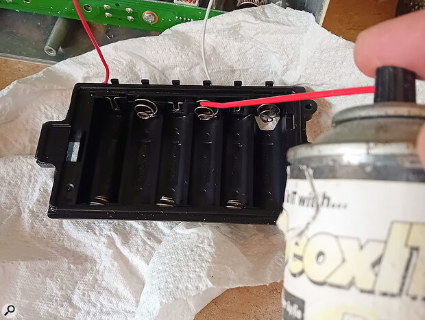 A final dry, scrape, and squirt of contact cleaner finishes the job.