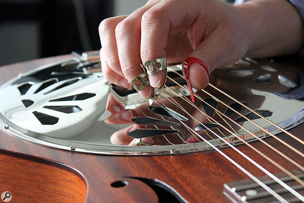 The squared-necked resonator is usually played with finger and thumb picks; the type of pick will have a significant bearing on the guitar’s tone.