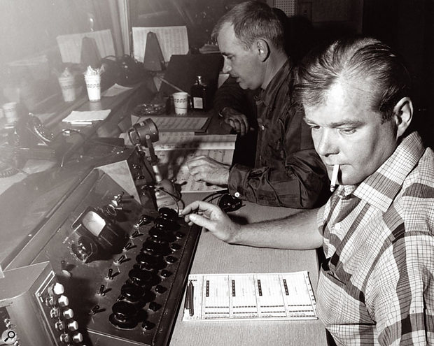 Bill Putnam at one of the mixing consoles he designed. 