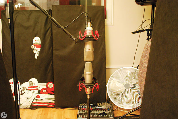 The Neumann U87 pair set up as an M-S array, with the upper one set to cardioid polar pattern, and the lower one to figure-of-eight and facing perpendicular to the kit.