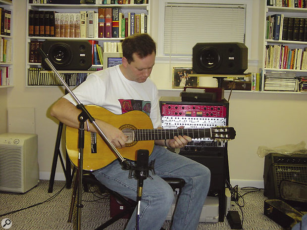 As suspected, Glenn's mic position, two feet in front of the sound hole, was creating a boomy sound which Glenn had been trying to correct with processing.