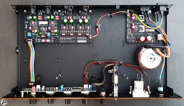 On the inside, you’ll find separate PCBs for the power supply (top right), the main audio processing circuitry (top left) and the main front‑panel controls (bottom).