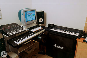 Michael Neilson's Pro Tools/Apple Mac workstation, with Mackie 1604 monitor mixer (top left), Roland A90 master keyboard, and Roland JP8000 synthesizer (right) atop a Marshall speaker cabinet from guitar‑playing days.