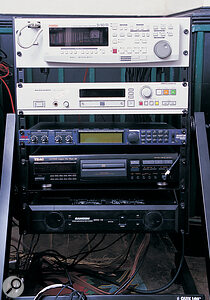 Sarah's using an Atari for MIDI sequencing, with a sync'ed D90 8‑track (equipment rack left, top) for digital audio. The Dbx Quantum in the same rack has given her the capacity to master at home.