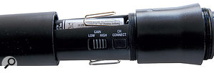 Inside the microphone is a button for linking it to a specific channel on the receiver, and a switch to select between high and low gain.