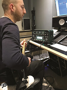 Guitarist and producer Jack Ross records a guitar part for FIBS.