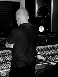 Chris Birkett looking thoughtful at the desk in Eden Studios.