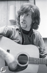 Left: Graham Nash playing acoustic guitar.