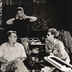 Depeche Mode during the making of Exciter: Dave  Gahan (standing), Andrew  Fletcher (left) and Martin  Gore.