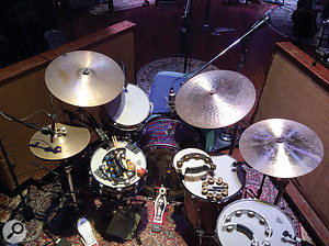 Visible in this shot of Ian Fitchuk’s drum kit are the SM57 and AKG C451 taped together on the snare, Josephson E22 tom mics, Neumann U47 directly above the kick drum and a  Neumann KM84 on hi–hat.