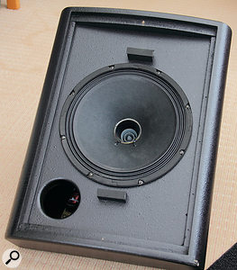 Removing the grille exposes the 10-inch woofer, with a one-inch compression driver mounted in the centre.