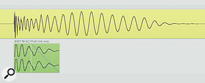 The yellow audio region here is the main kick‑drum sample, and you can see how the onset of the longer‑wavelength low‑frequency information is delayed compared to the start of the drum hit. This made the drum sound out of time. Mike's solution was to add an additional kick‑drum sample (green audio region) to beef up the low‑frequency attack. Notice how this has been shortened with a fade‑out to avoid conflicting with the existing low-end energy.