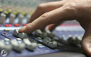 You may find that the action of a  mix compressor tends to 'fight' your fader moves when mixing.