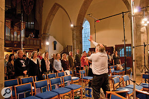 The aim of the recording as a whole was to present an authentic performance of the St John Passion in its liturgical context. The ancillary material required a larger chorus to act as a congregation.