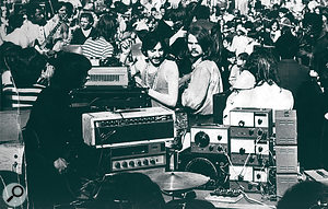 This photo was taken at an earlier, outdoor concert in New York City, again in 1968, "before the plywood configuration, where I just had all my oscillators, amps, pedals, and so on piled onto a table. There were 30,000 people in the audience — we were terrified!”