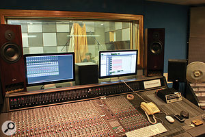 Matt's view over the Amek Angela console and through the glass to the live room. Note the configuration of Pro Tools, with the takes and waveforms on one screen and the mixer on another, which is a useful setup for this sort of tracking session.