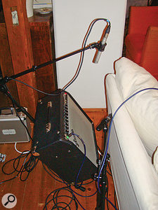 Here you can see how the two guitar amps were set up, tilted using K&M 28130 amp stands so that they were more audible to the guitarists playing them. Notice also the dual-miking setup, combining a more distant Samson C02 small-diaphragm condenser mic (supported via the amp stand's integrated boom arm) with a closer off-axis Shure SM57 dynamic.