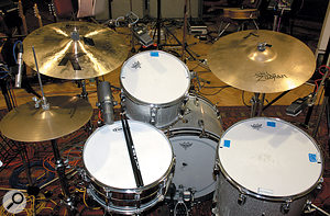 The drum close-miking arrangement was fairly conventional, with AKG C414s on toms, Shure SM7 on snare and Neumann KM84s spot miking the hi-hat and ride (not visible).