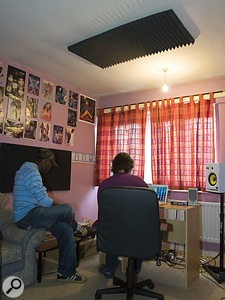 In this shot, you can see the studio after it has been treated, with Auralex foam at the mirror points on the walls and ceiling, and the speakers brought much closer together.