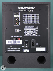 The rear panel of the right speaker, which houses the audio interface. This hosts the auxiliary inputs, the power socket, the USB port and the amplified output to the passive speaker.