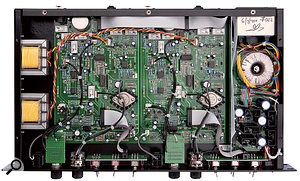 The Fox's internal construction is to very high standards, with the linear power supply isolated behind a metal screen to the right, and the output transformers mounted on the left-hand side wall. The three small socketed ICs on each channel's circuit board are OPA2604 op-amps, while the two large ICs are logic control chips for the relays.