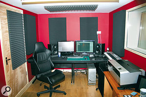 To minimise problems with bass in small and medium-sized rooms, make sure your speakers aim down the length of the room, pointing towards the listener's ears. In this picture, you can also see the 'mirror‑point' acoustic treatment that is used to absorb mid-range and high frequencies, resulting in better stereo imaging.