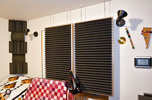 Absorbers were hung from the ceiling, a short distance away from the walls to increase their efficacy at low frequencies.