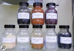 These bottles contain samples of all the ingredients needed to produce magnetic tape: ferric oxide, resins, solvents and more.